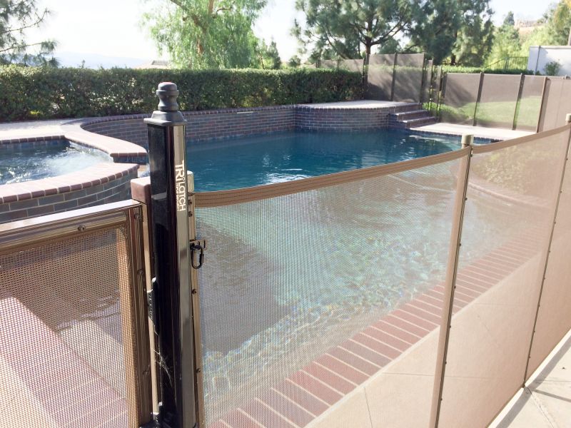 Mesh Fence Secured to Pool Deck